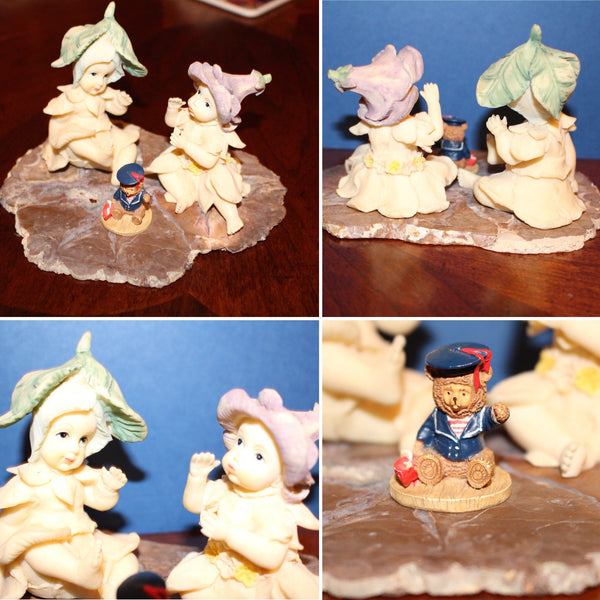 Vintage Garden Fairies Playing with a Bear Toy Sitting on a Slab